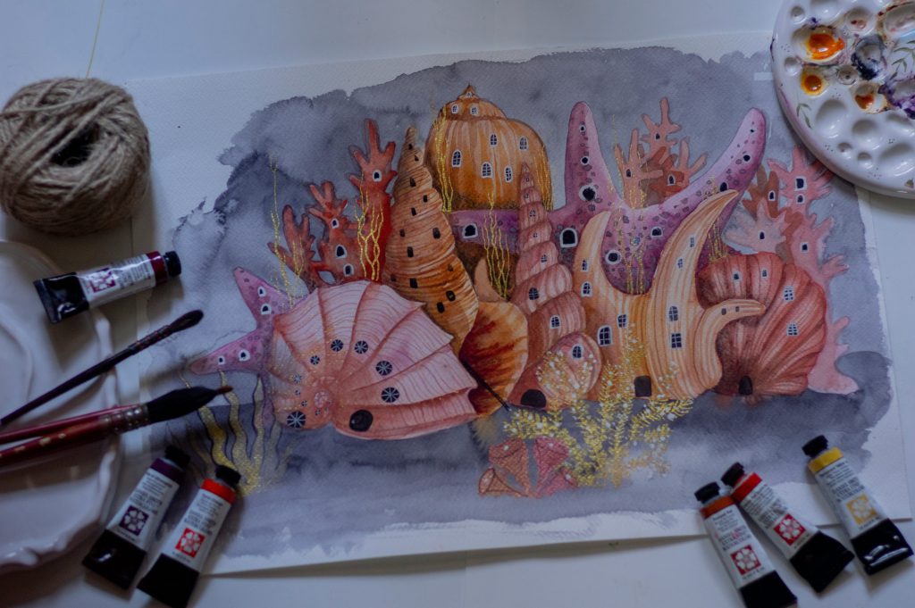 Na zdjęciu widać akwarelową ilustrację przedstawiającą fantastyczne podwodne miasto