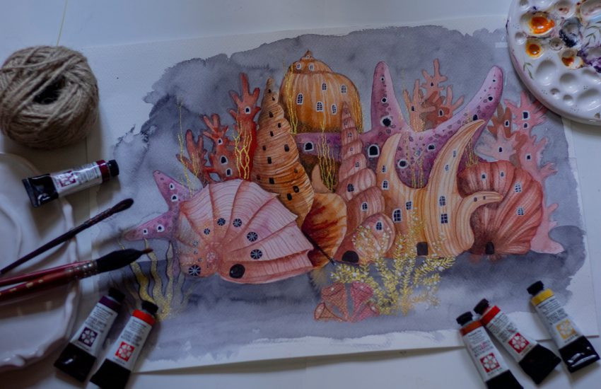 Na zdjęciu widać akwarelową ilustrację przedstawiającą fantastyczne podwodne miasto