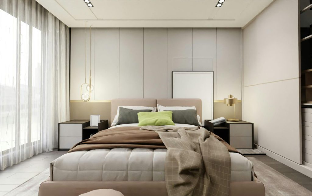 Nowoczesne łóżko kontynentalne z pojemnikiem w kolorze beżowym, ustawione na tle tapicerowanego panelu ściennego w eleganckiej sypialni.