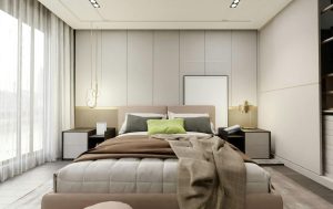 Nowoczesne łóżko kontynentalne z pojemnikiem w kolorze beżowym, ustawione na tle tapicerowanego panelu ściennego w eleganckiej sypialni.